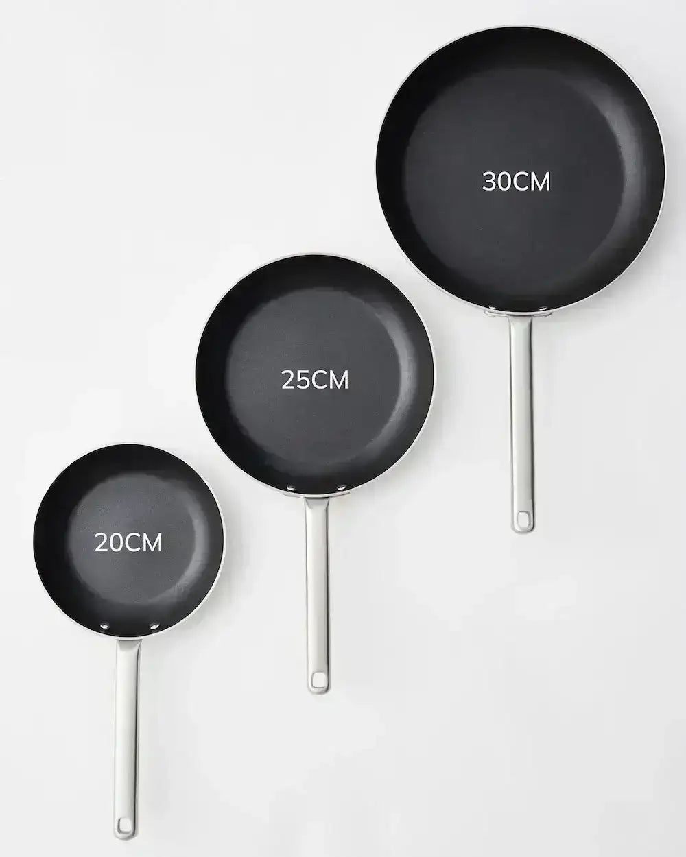 Set of three black nonstick frying pans with stainless steel handles sized 20cm, 25cm, and 30cm on white background
