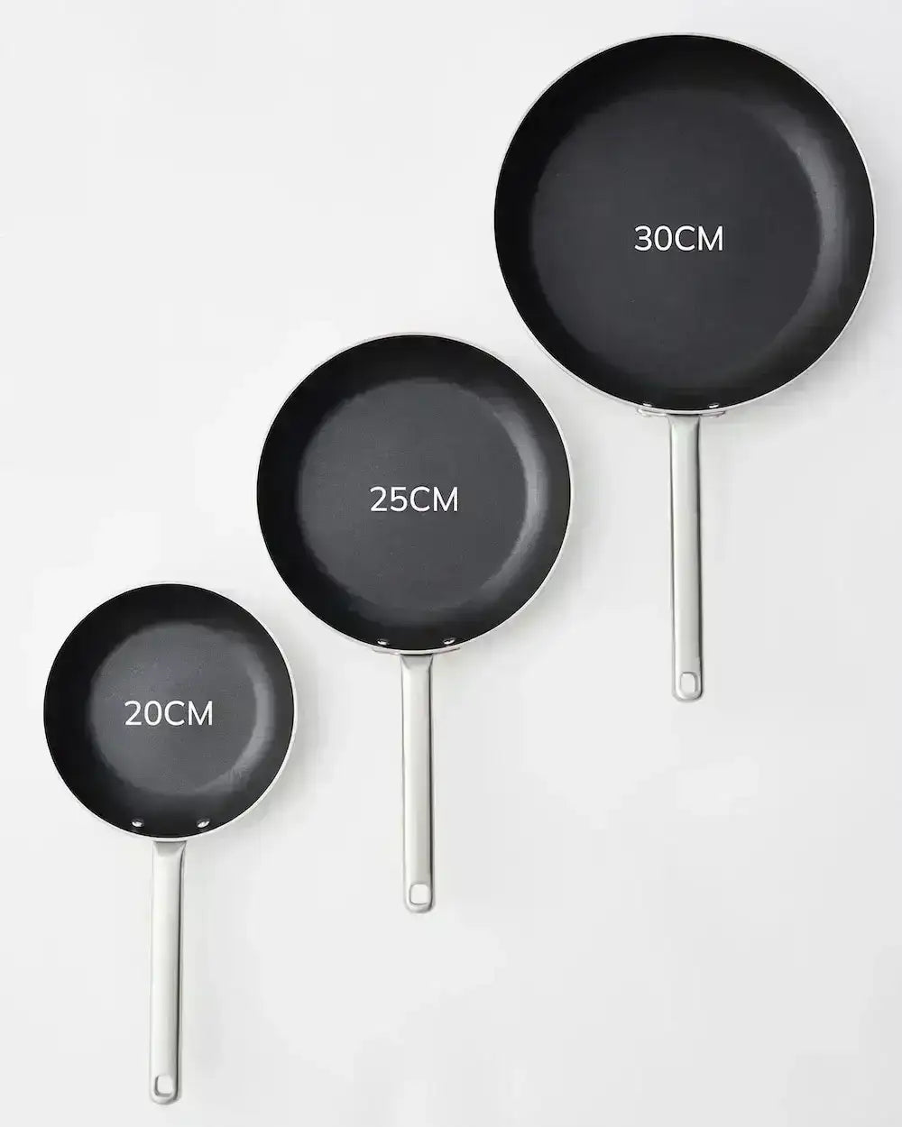 Three nonstick frying pans in 20cm, 25cm, and 30cm sizes on a white background