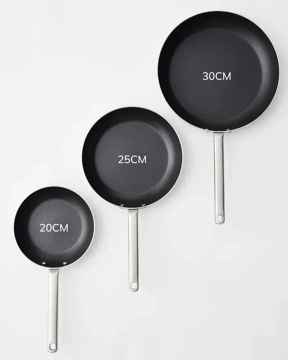 Set of three black nonstick frying pans with metal handles, sizes 20cm, 25cm, and 30cm