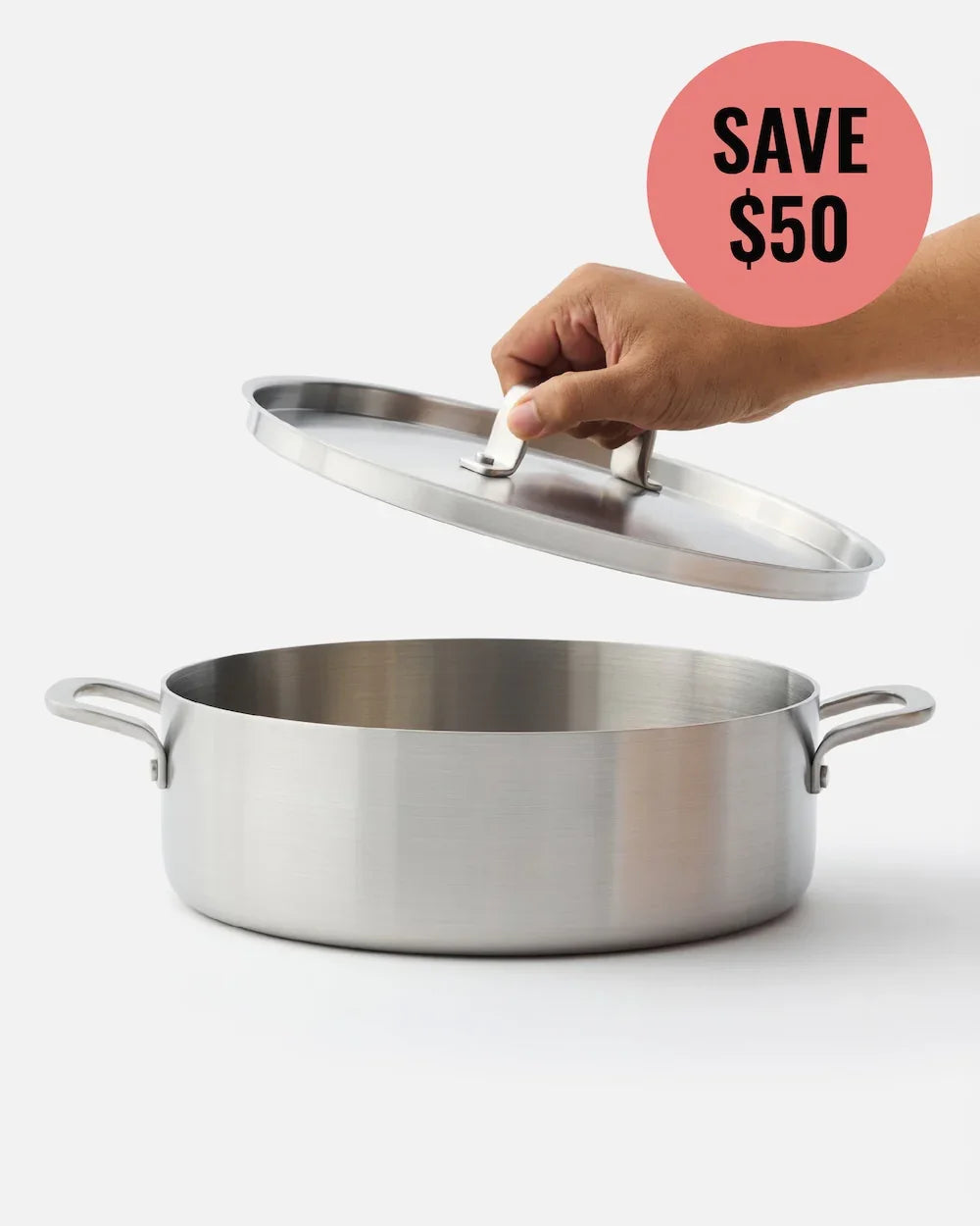 Hand lifting lid off stainless steel saucepan with discount save $50 label
