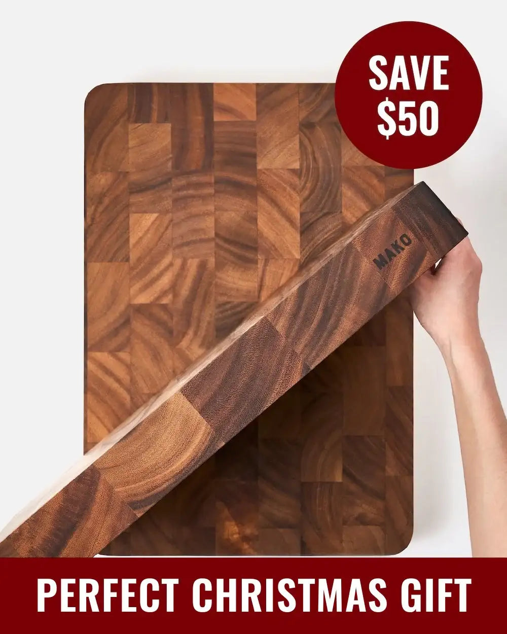 Thick wooden Mako cutting board held by a hand, perfect Christmas gift with $50 savings