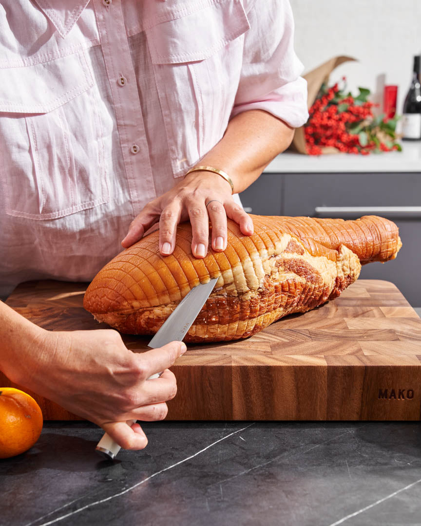 Carving a glazed ham on a MAKO wooden board