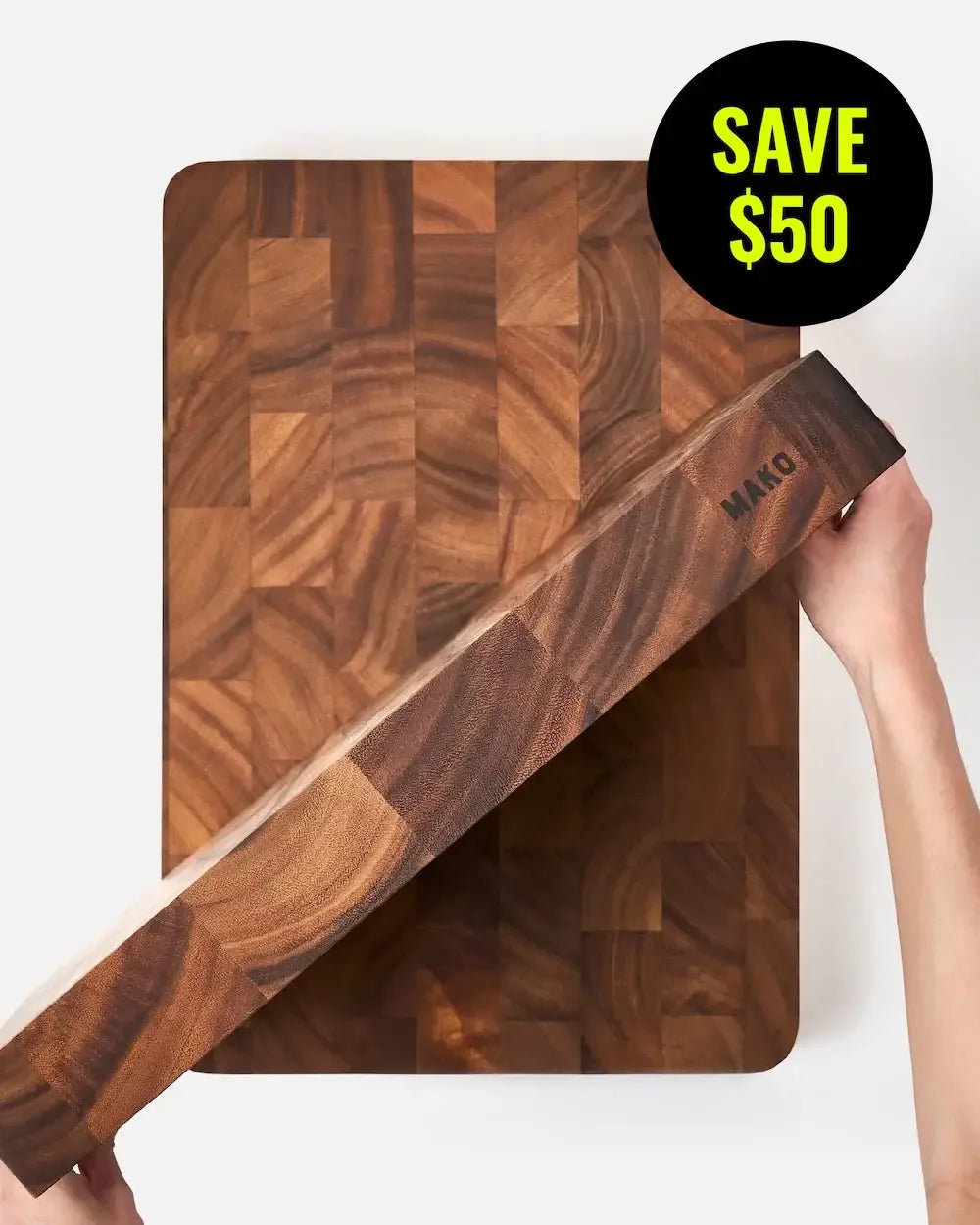 Thick wooden butcher block cutting board with end grain pattern and SAVE $50 badge.