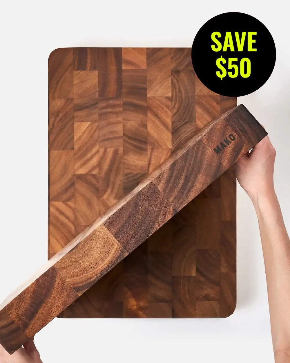 Thick wooden butcher block cutting board with end grain pattern and SAVE $50 badge.