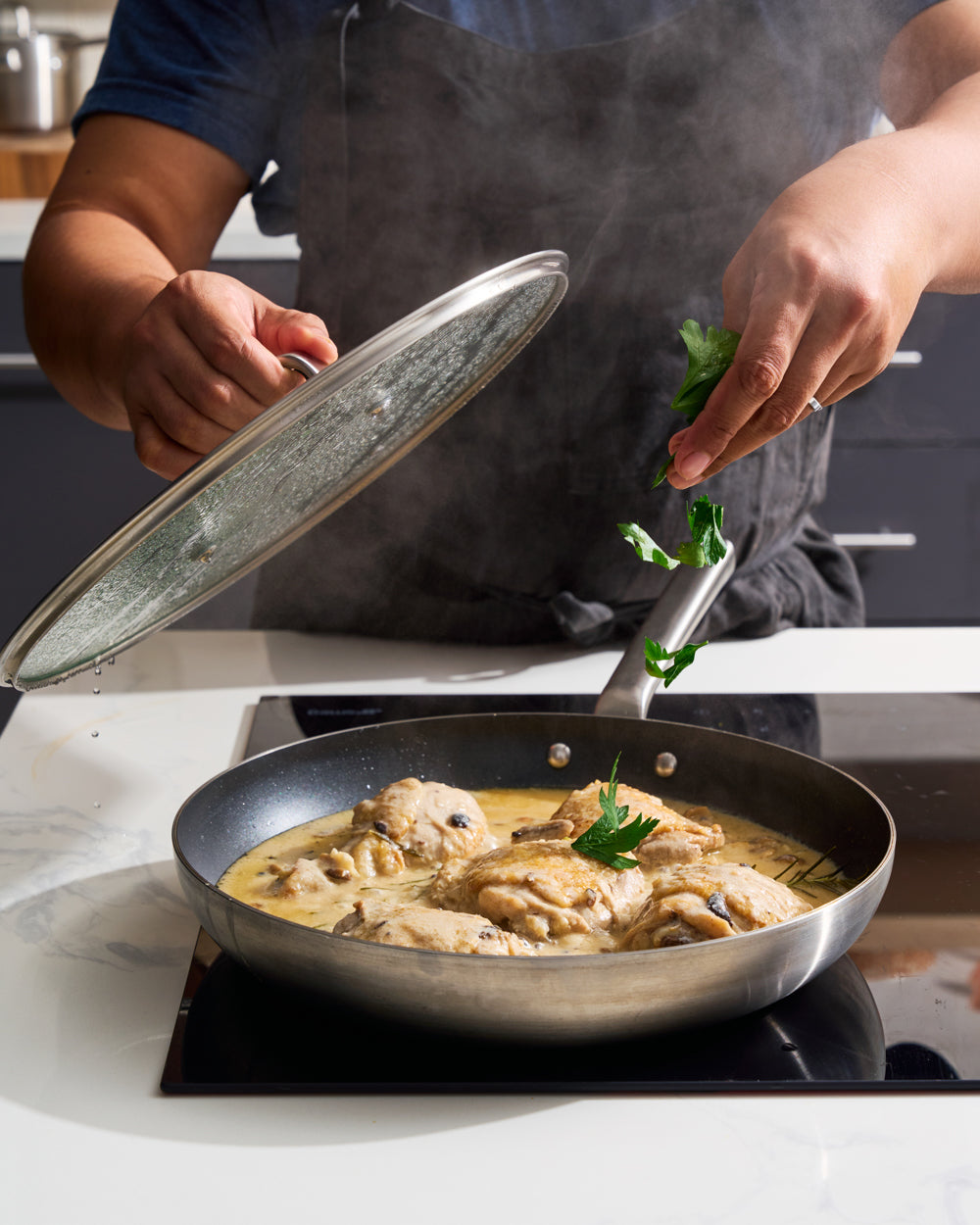 MAKO GENIUS 5-PLY NON-STICK FRYING PAN TRIO with LID - CookDineHost on stove top sprinkle parsley on chicken