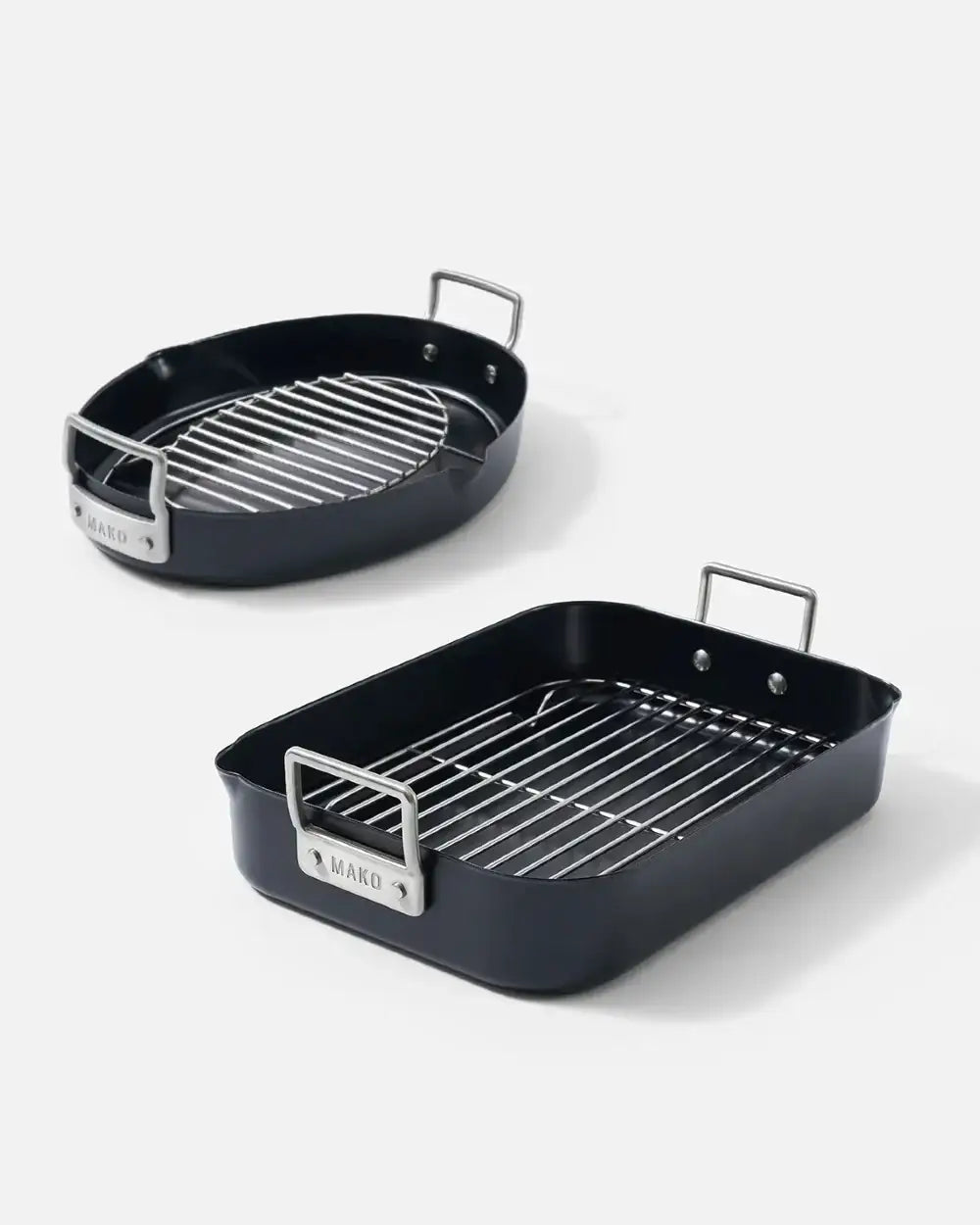 Non-stick roaster set with metal racks and handles, featuring two black pans in oval and rectangular shapes