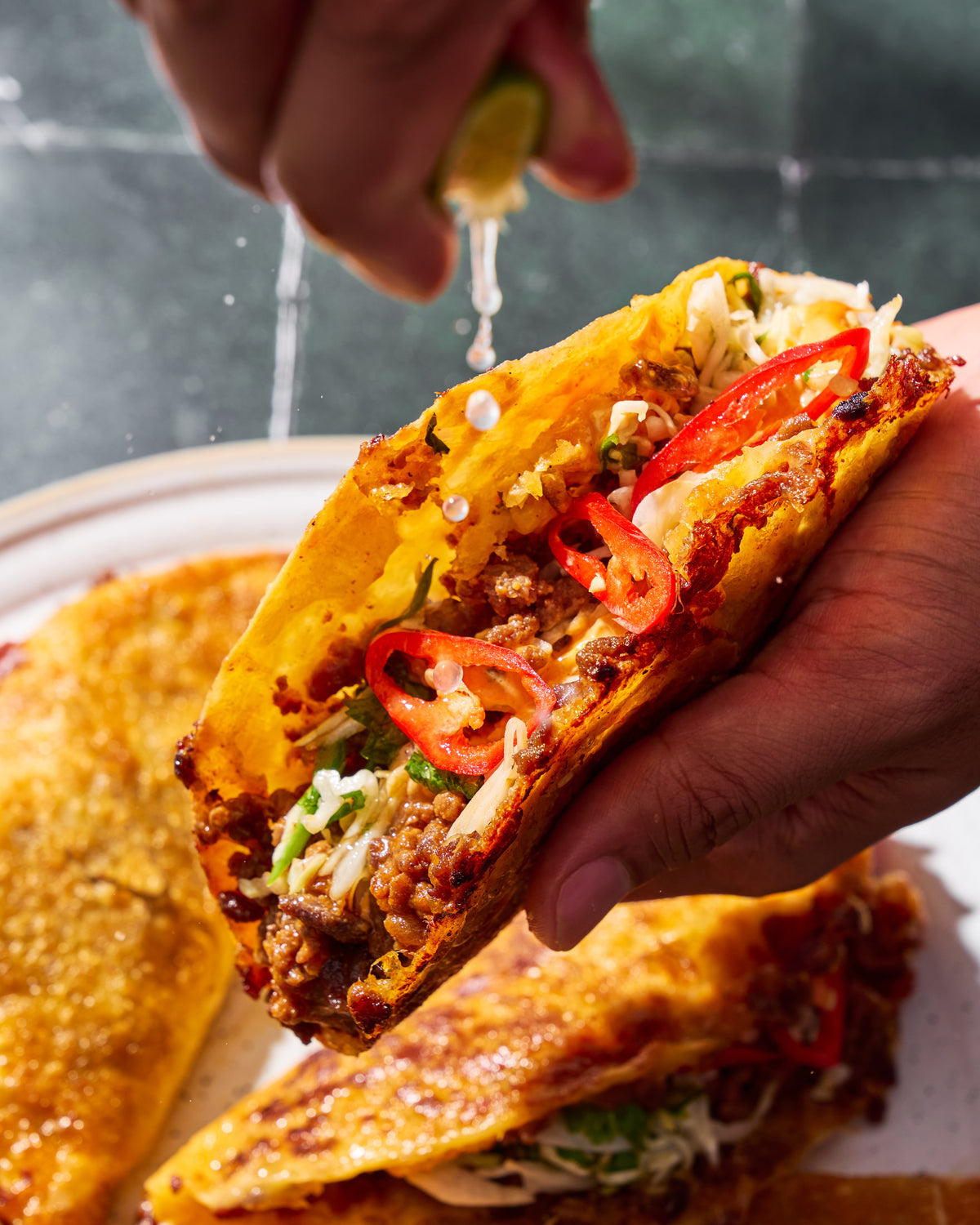 Crispy tacos served with fresh slaw and red chilly