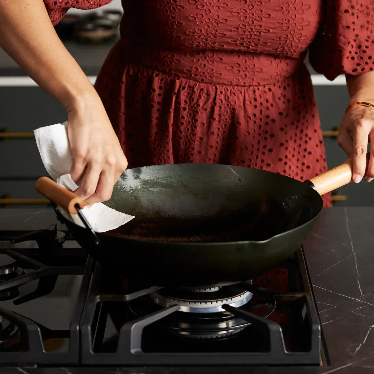 Step 2 - Once your wok is clean, rinse the wok and dry with a tea towel or paper towel.