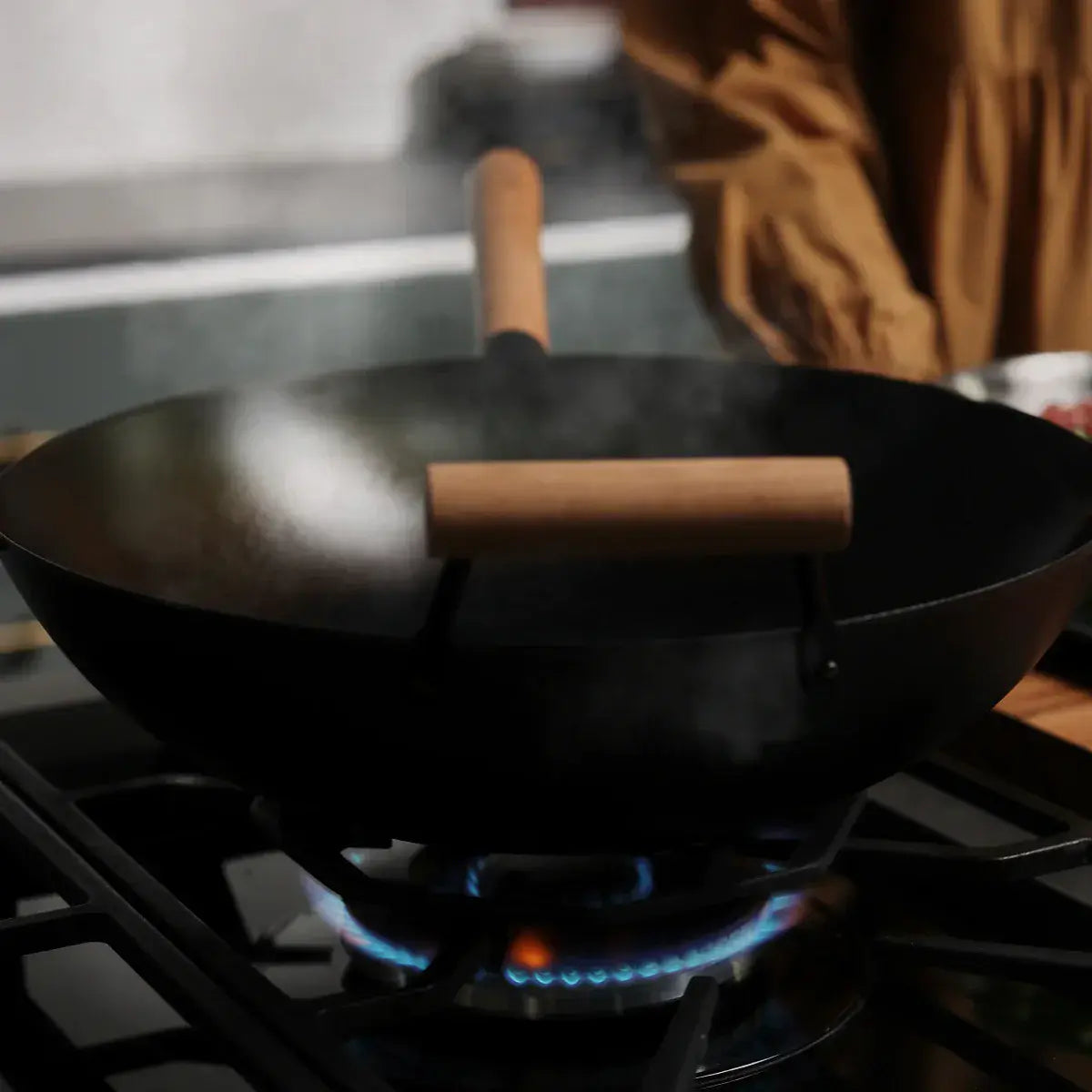Step 3 - Heat your wok on your cooktop on a medium heat until you see light smoke appear.