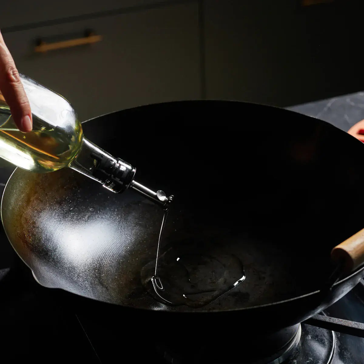 Step 4 - Add two teaspoons of vegetable oil to your hot wok.