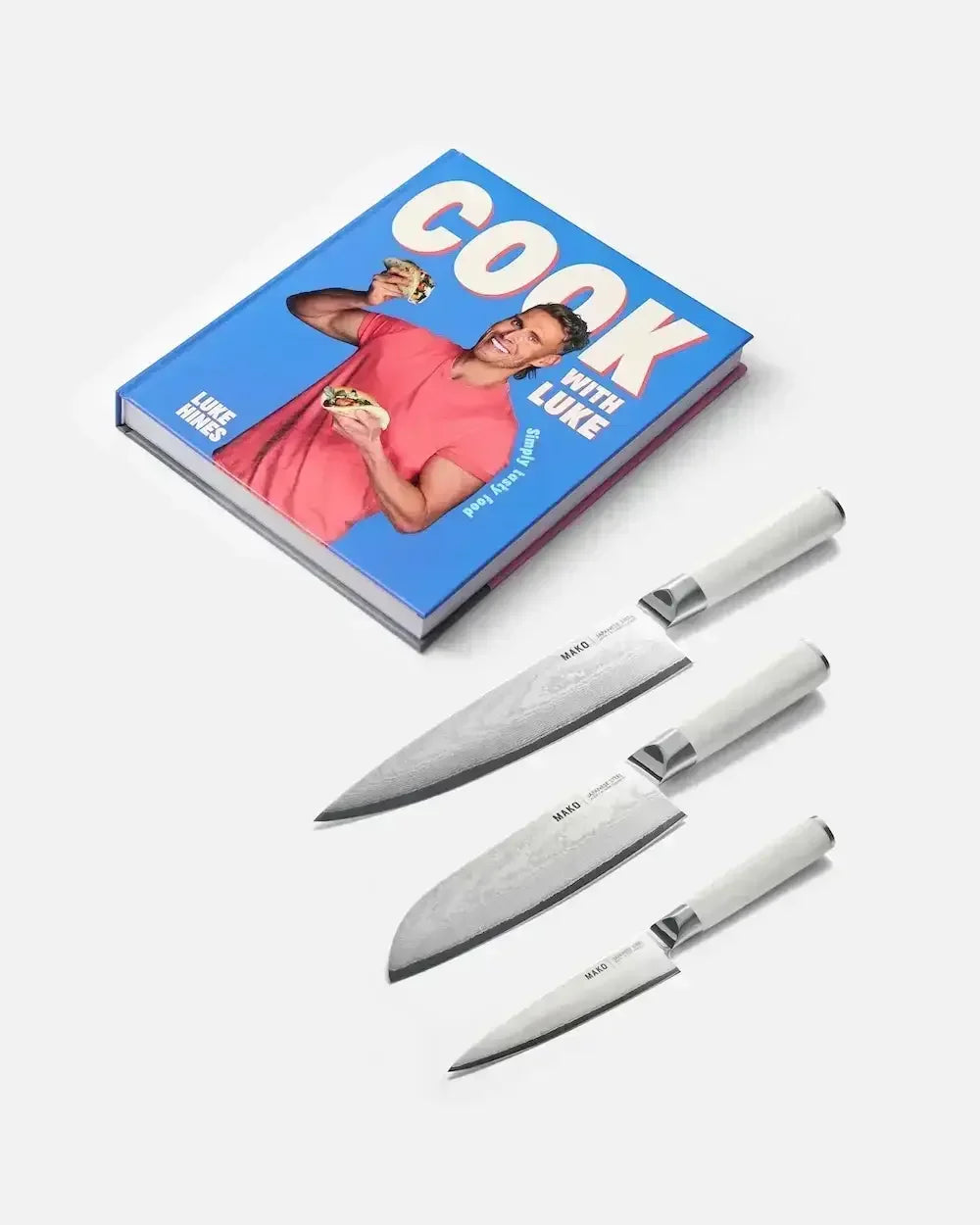 Cookbook and three MAKO kitchen knives with white handles on white background