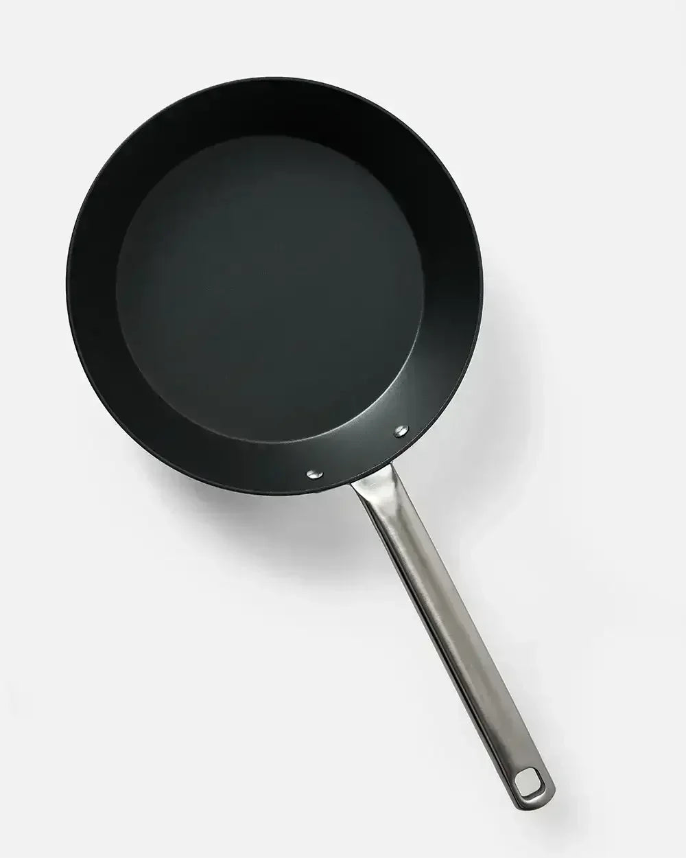 Nonstick black sear pan with metal handle on white background, premium cookware