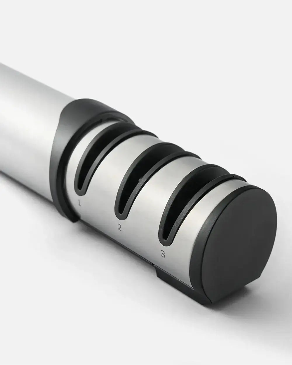 Mako knife sharpener by Marion Grasby with three-stage sharpening slots in stainless steel and black plastic