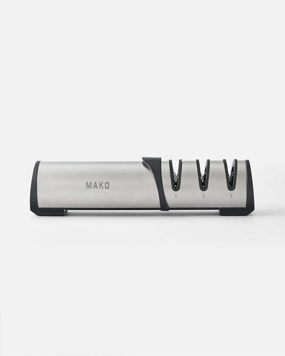 Stainless steel MAKO knife sharpener with three sharpening slots on a plain background