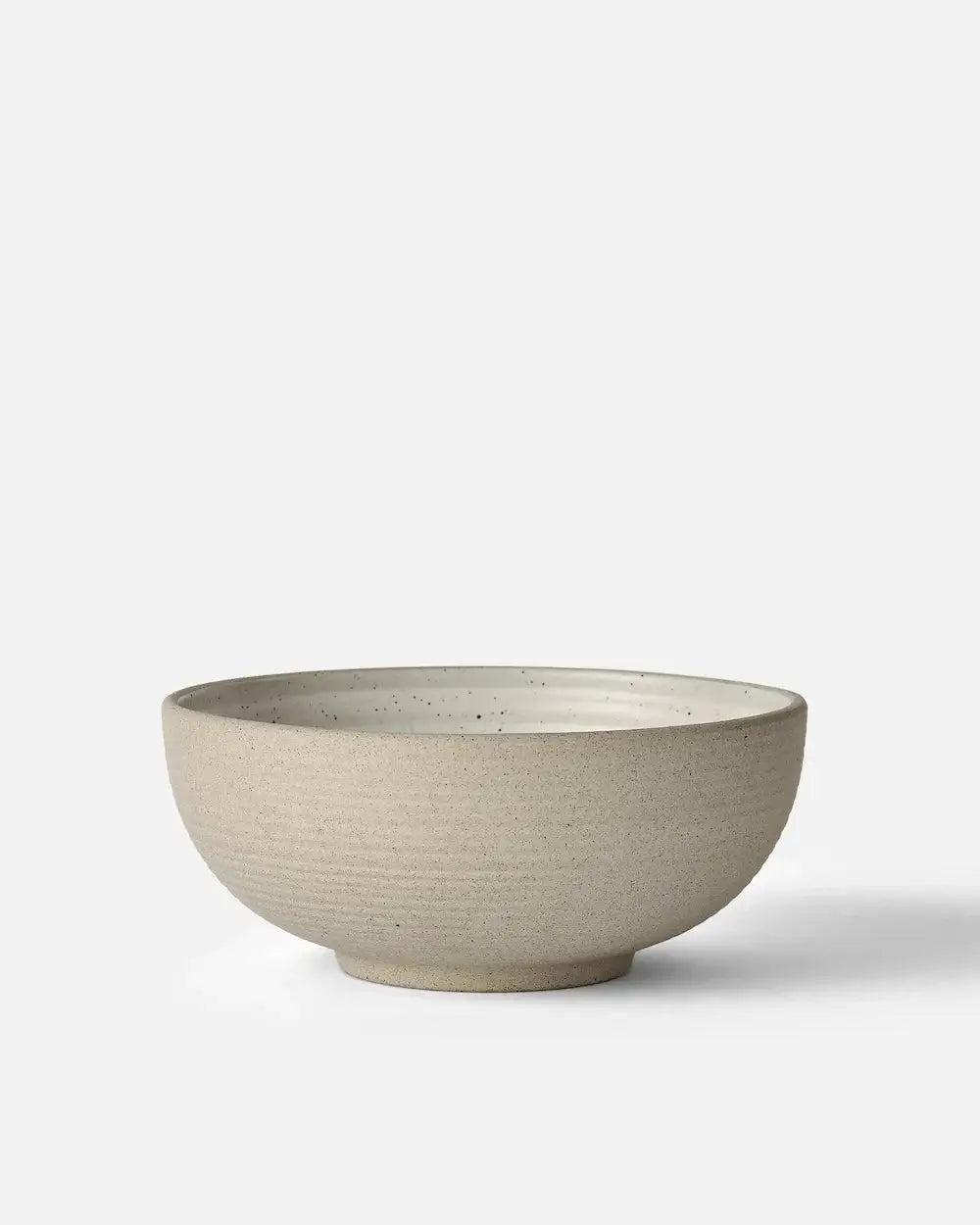 Minimalist beige ceramic cereal bowl by Marion Grasby with textured matte finish