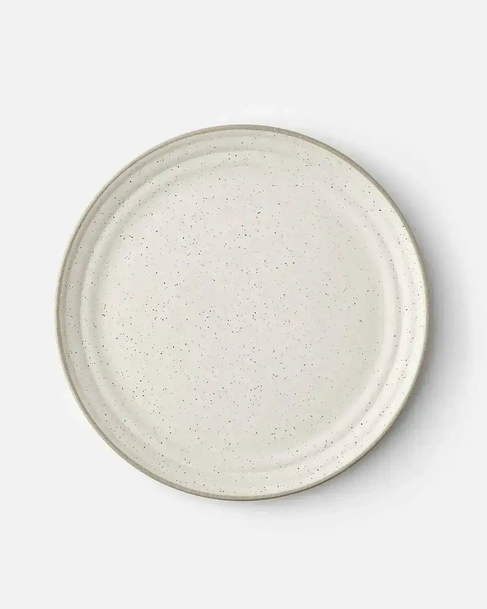 Speckled beige ceramic dinner plate with a minimalist design by Marion Grasby