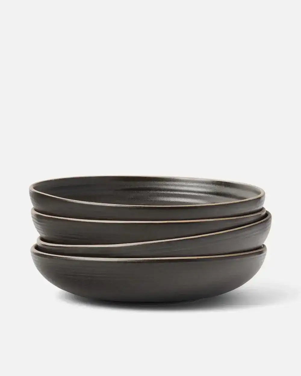 Stack of three dark charcoal wide ceramic bowls by Asoke, designed by Marion Grasby