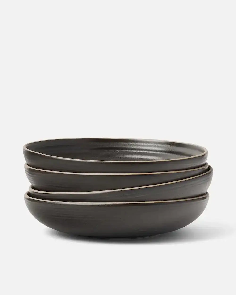Stack of three wide charcoal bowls from Marion Grasby's Asoke collection with subtle textured finish