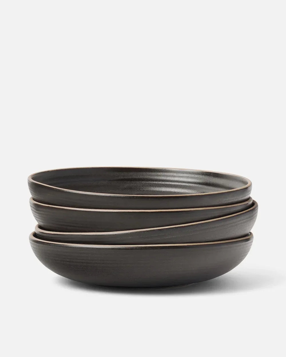 Stack of three wide charcoal bowls from Marion Grasby's Asoke collection with subtle textured finish