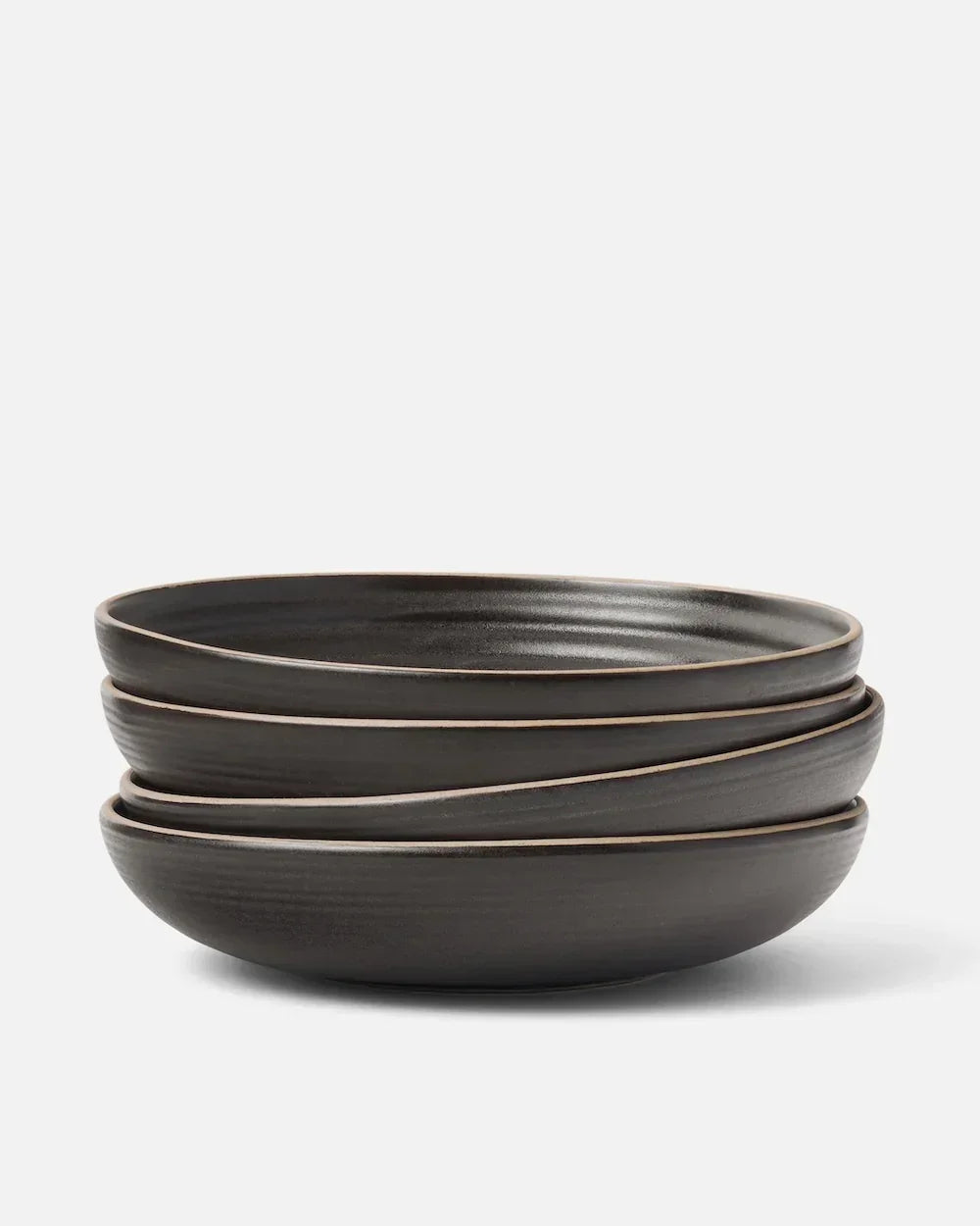 Stack of three charcoal wide bowls with a matte finish by Marion Grasby's Asoke collection