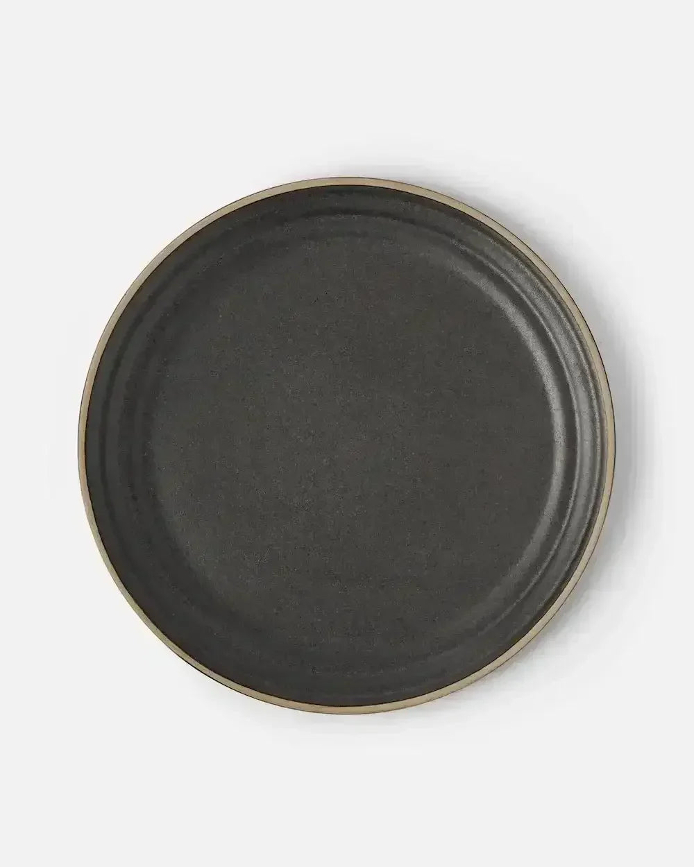 charcoal stoneware dinner plate with matte finish and subtle rim on white background