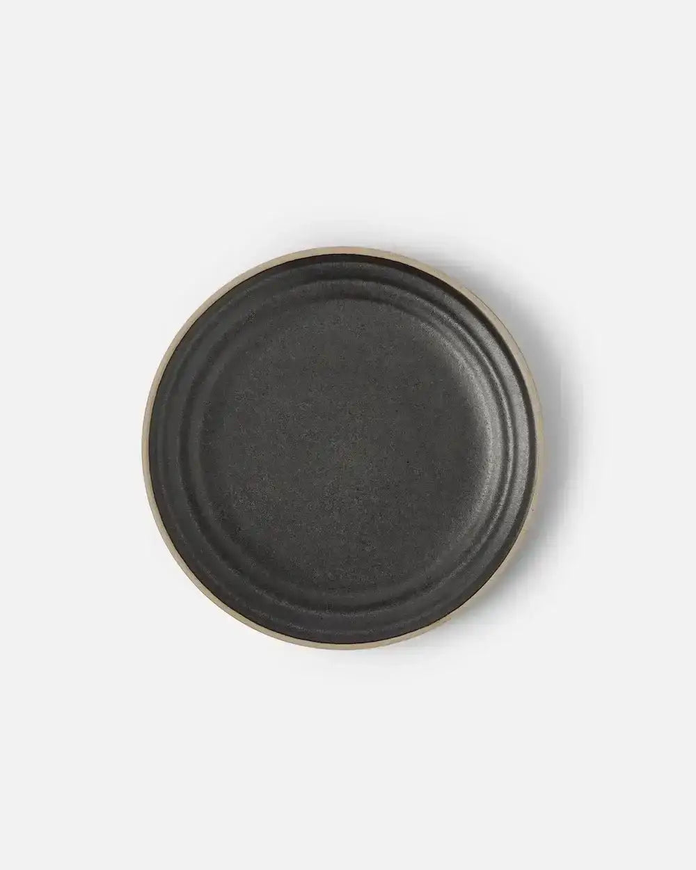 Charcoal ceramic side plate with a textured surface and natural rim by Marion Grasby's Asoke collection