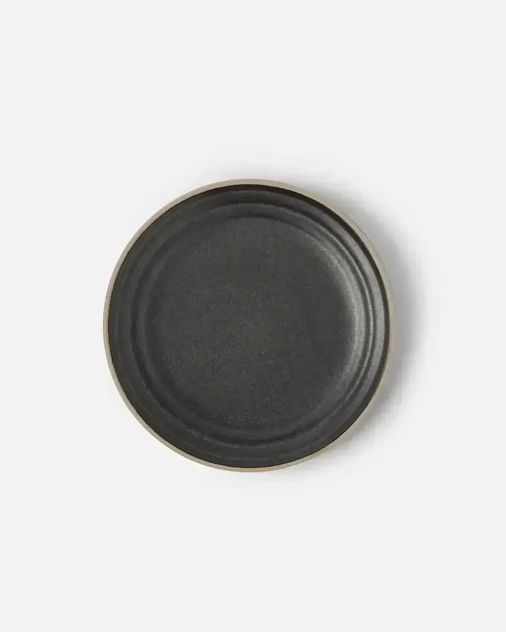 Charcoal stoneware side plate with a matte finish on a white background