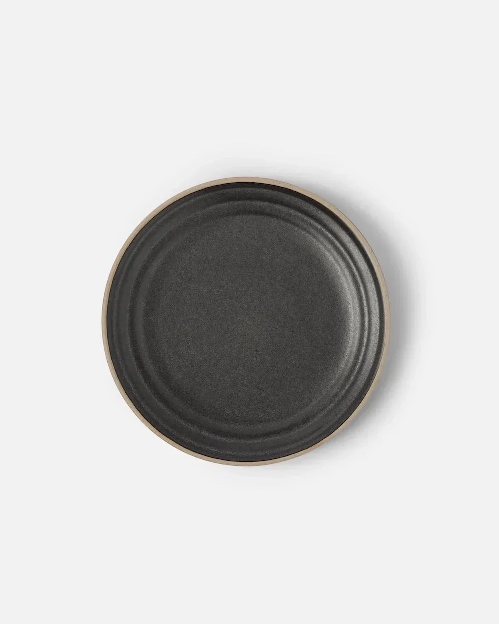 Asoke charcoal side plate by Marion Grasby, textured dark ceramic with natural rim detail