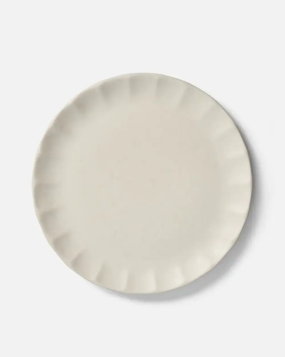 Calida Dinner Plate by Marion Grasby, white ceramic with fluted edge design on a white background