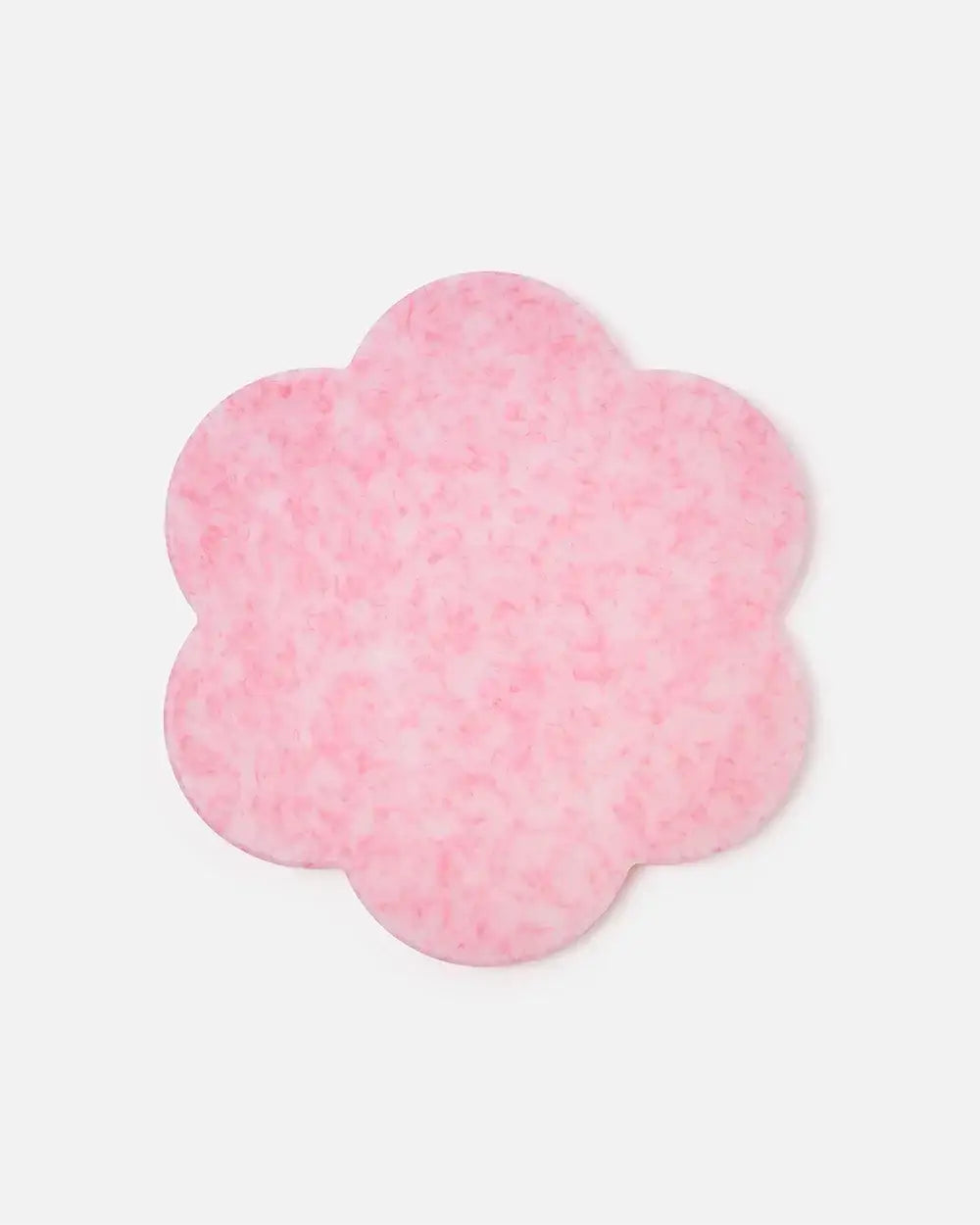 Pink flower-shaped marble cutting board by Marion Grasby with subtle white and darker pink speckles