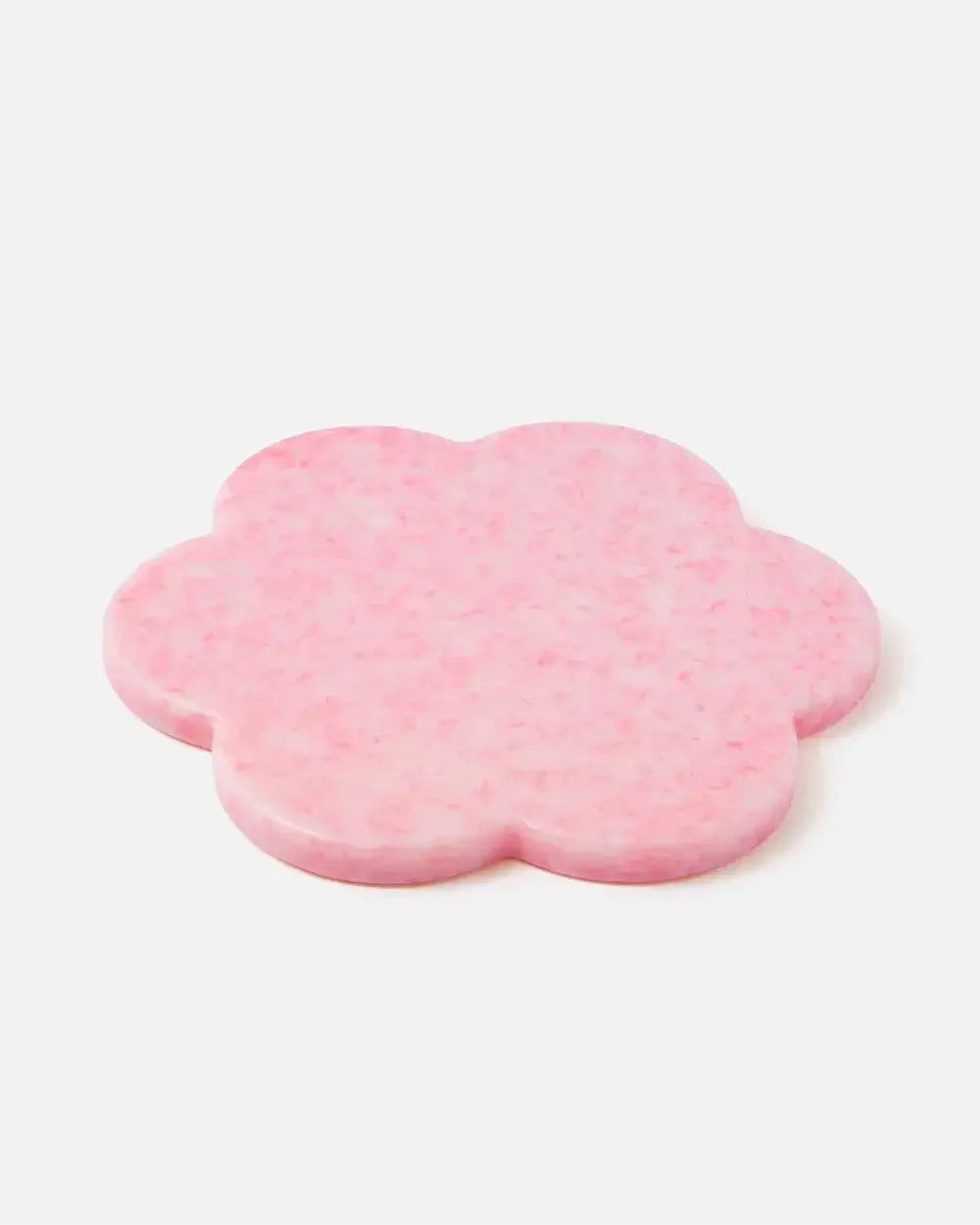 Pink flower-shaped resin trivet or coaster with a smooth finish on a white background
