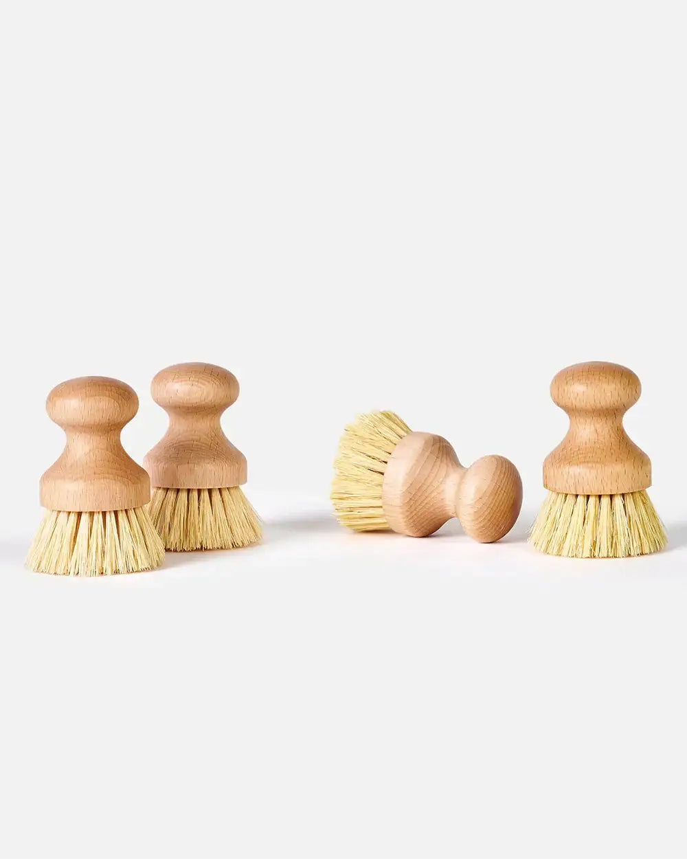 Set of four wooden vegetable brushes with natural bristles on white background, Marion Grasby kitchen utensils