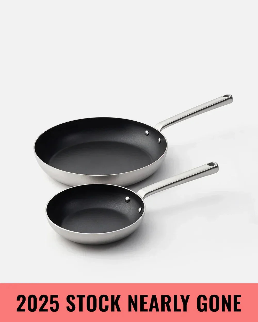 Set of two stainless steel non-stick frying pans with long handles on white background