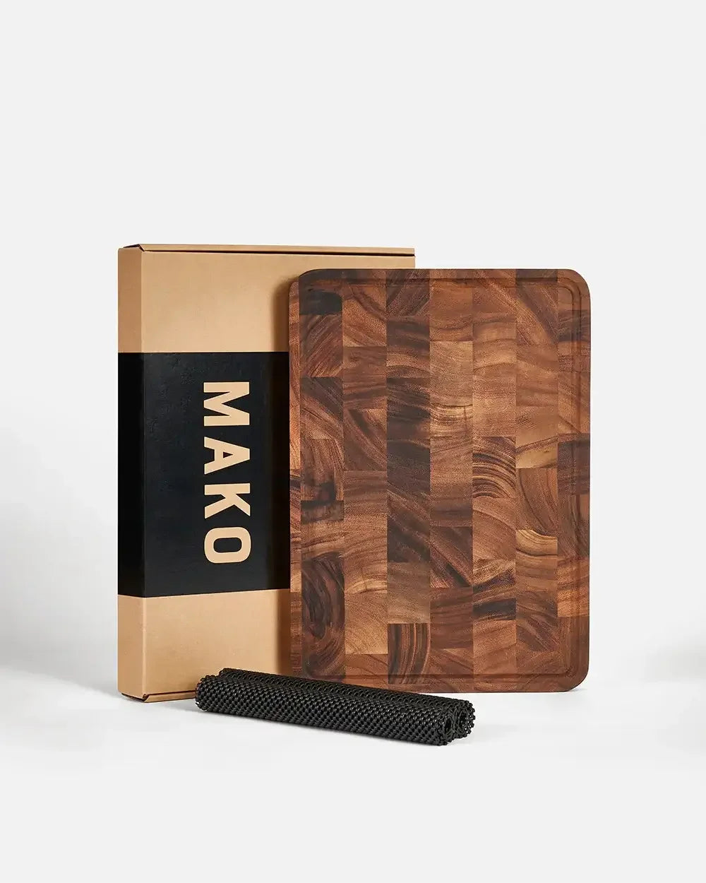 Wooden all-purpose chopping board with non-slip mat and packaging, kitchen accessory