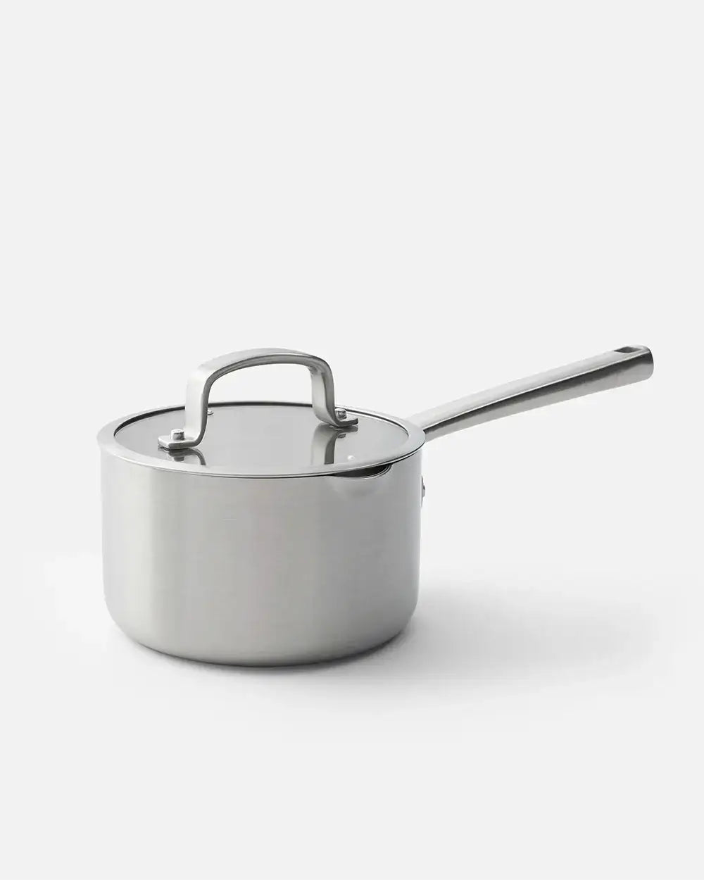 Stainless steel Mako saucepan with lid and long handle on white background by Marion Grasby