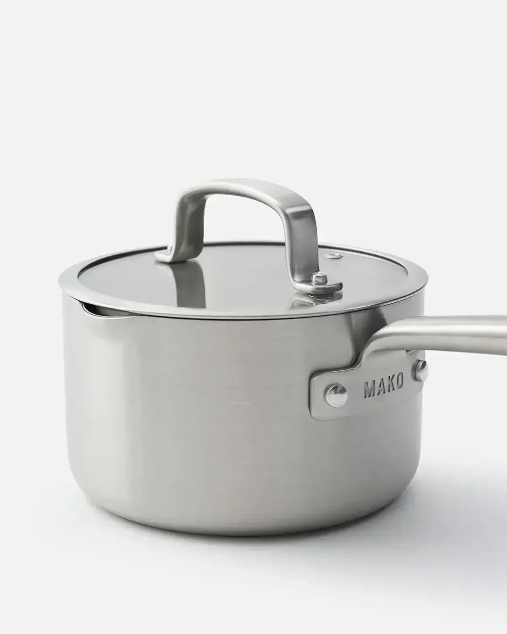 Stainless steel saucepan with lid and handle, MAKO logo visible on the side