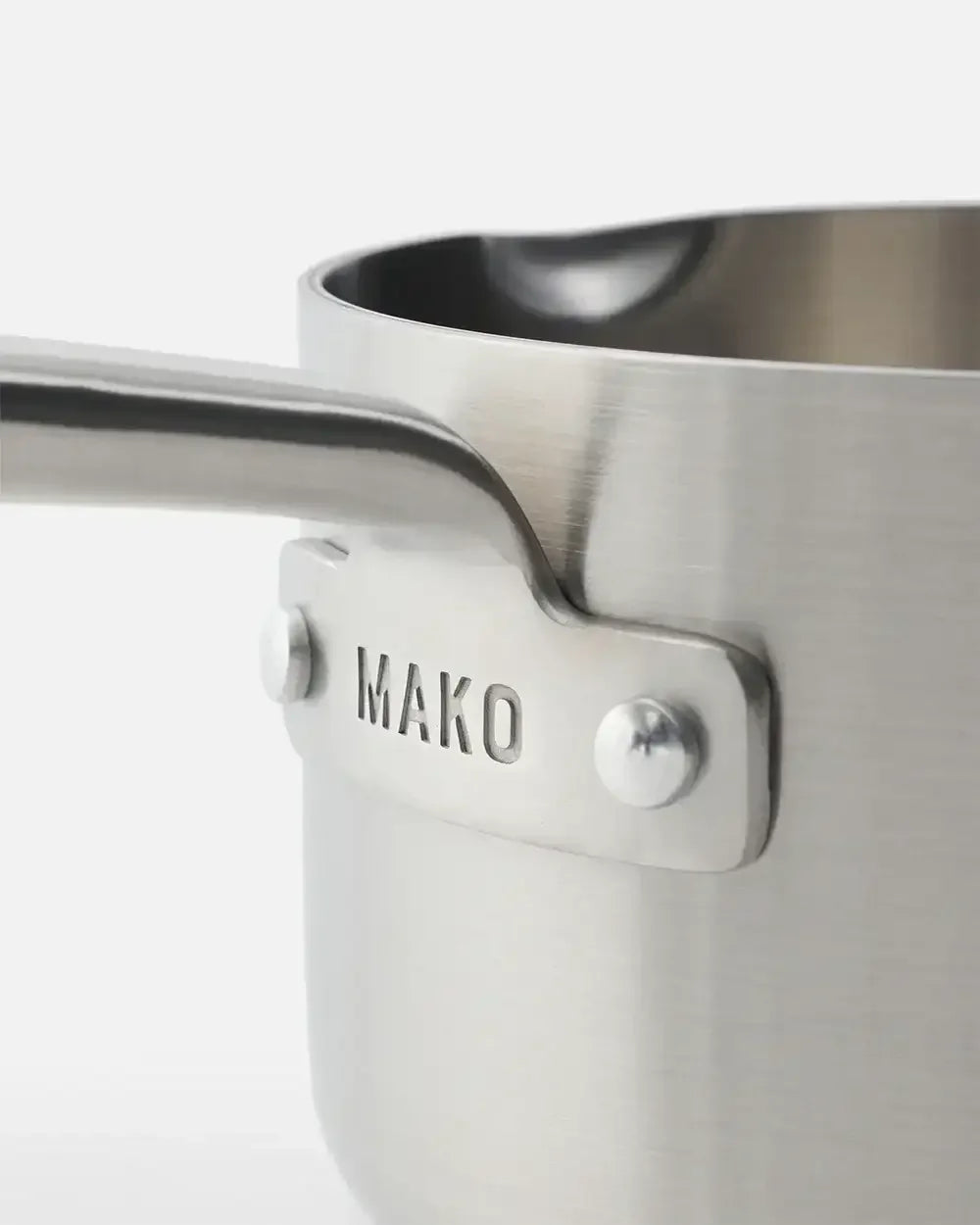 Close-up of MAKO stainless steel saucepan with ergonomic handle and brushed finish