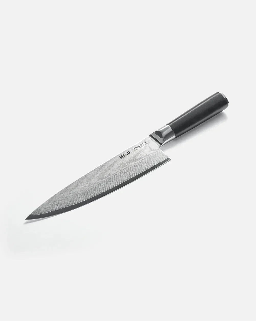 Mako Japanese steel chef knife with black handle designed by Marion Grasby on white background