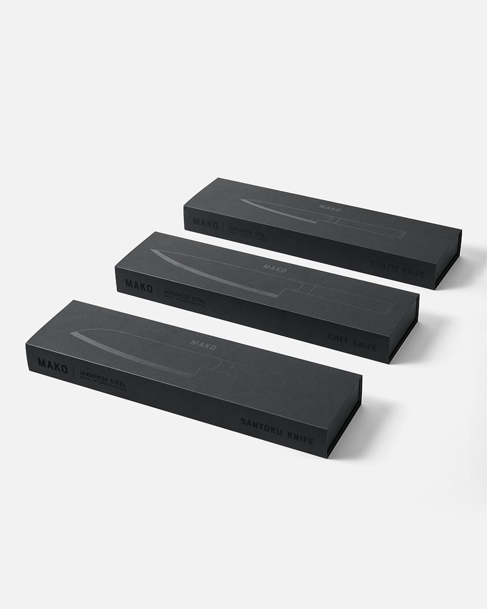 Three MAKO black knife boxes with Japanese steel chef knives on white background