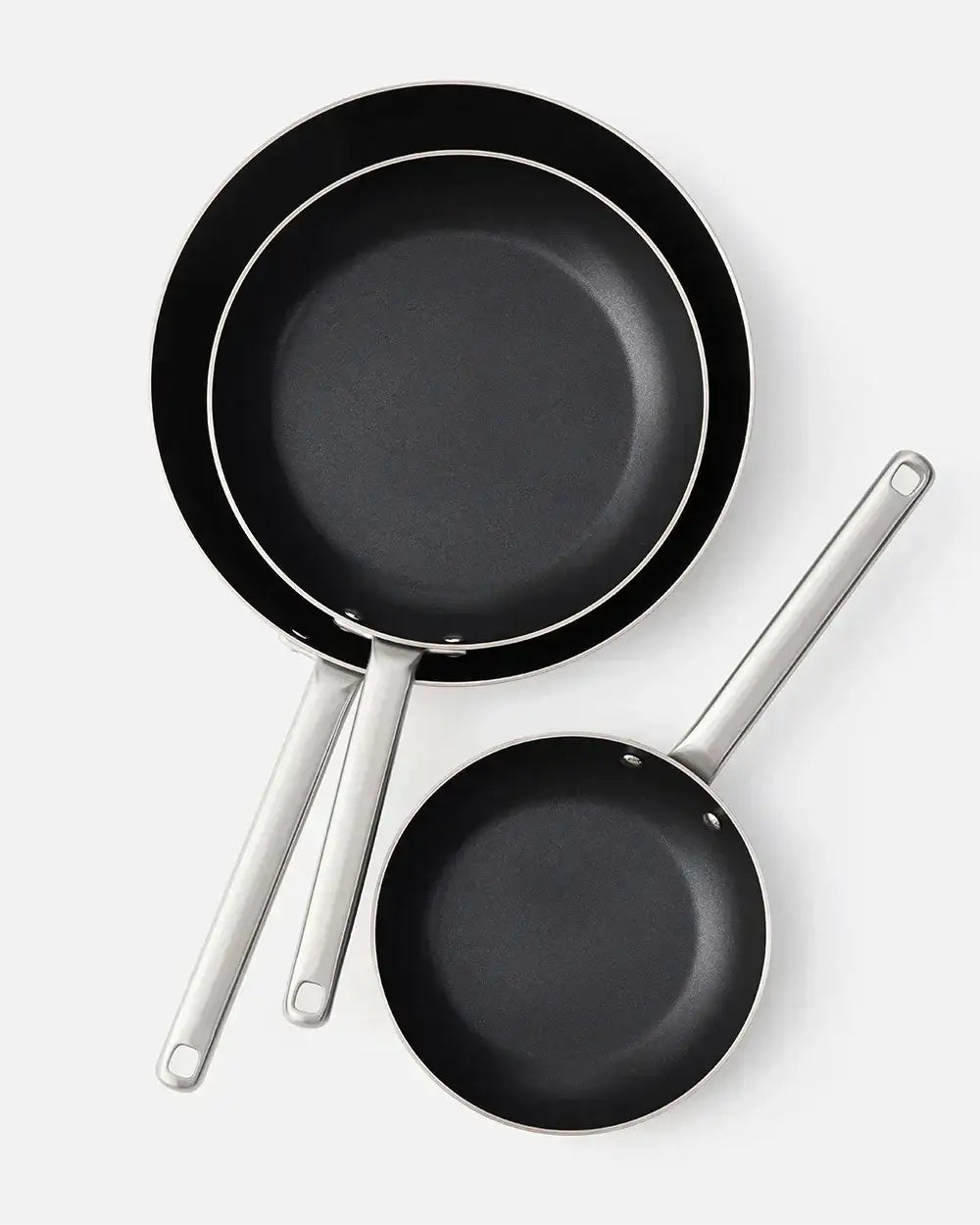 Set of three black non-stick frying pans with stainless steel handles by Marion Grasby's Mako collection