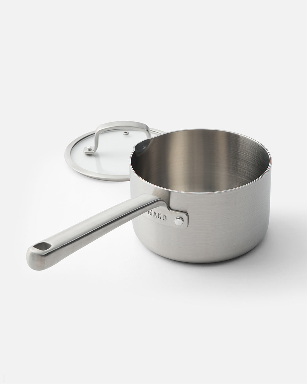 Stainless steel saucepan with lid and long handle on white background