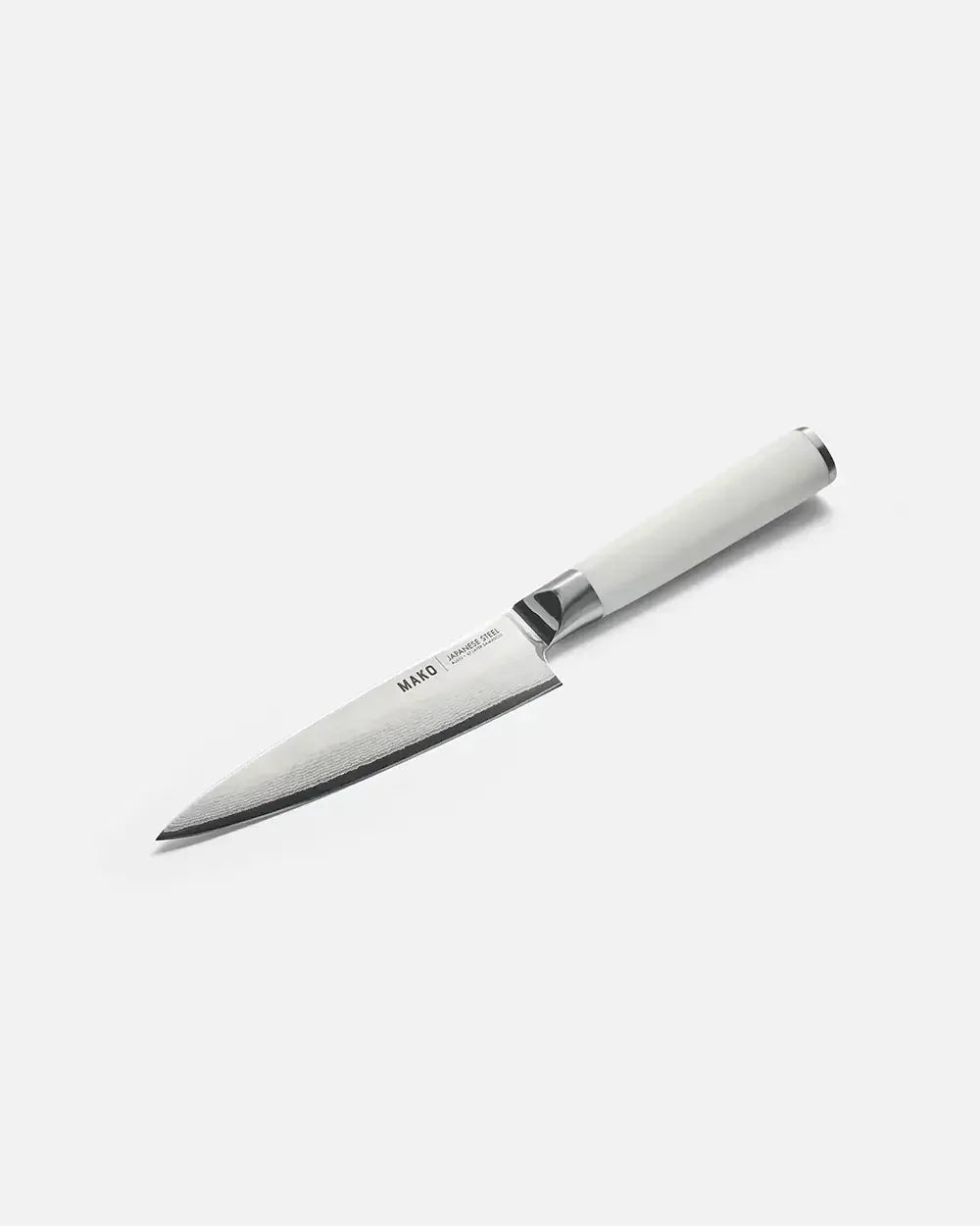 Japanese steel utility knife with white handle on plain background