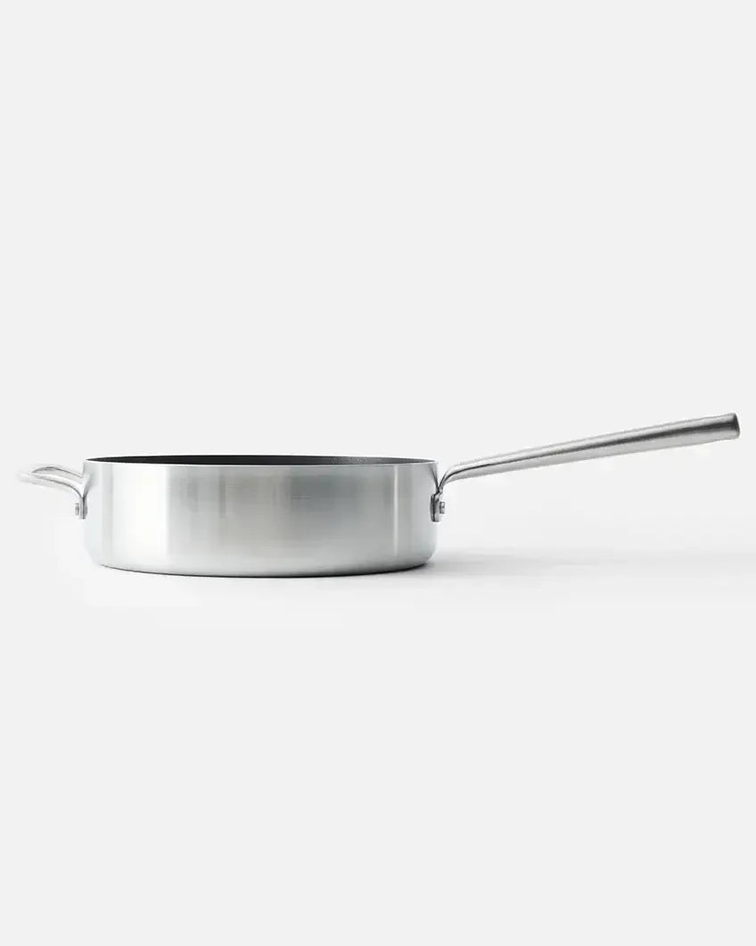 Stainless steel sauté pan with long handle and helper handle on white background