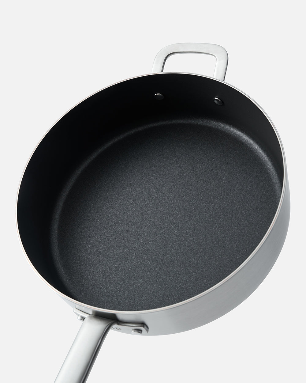 Nonstick sauté pan with stainless steel handle on a white background