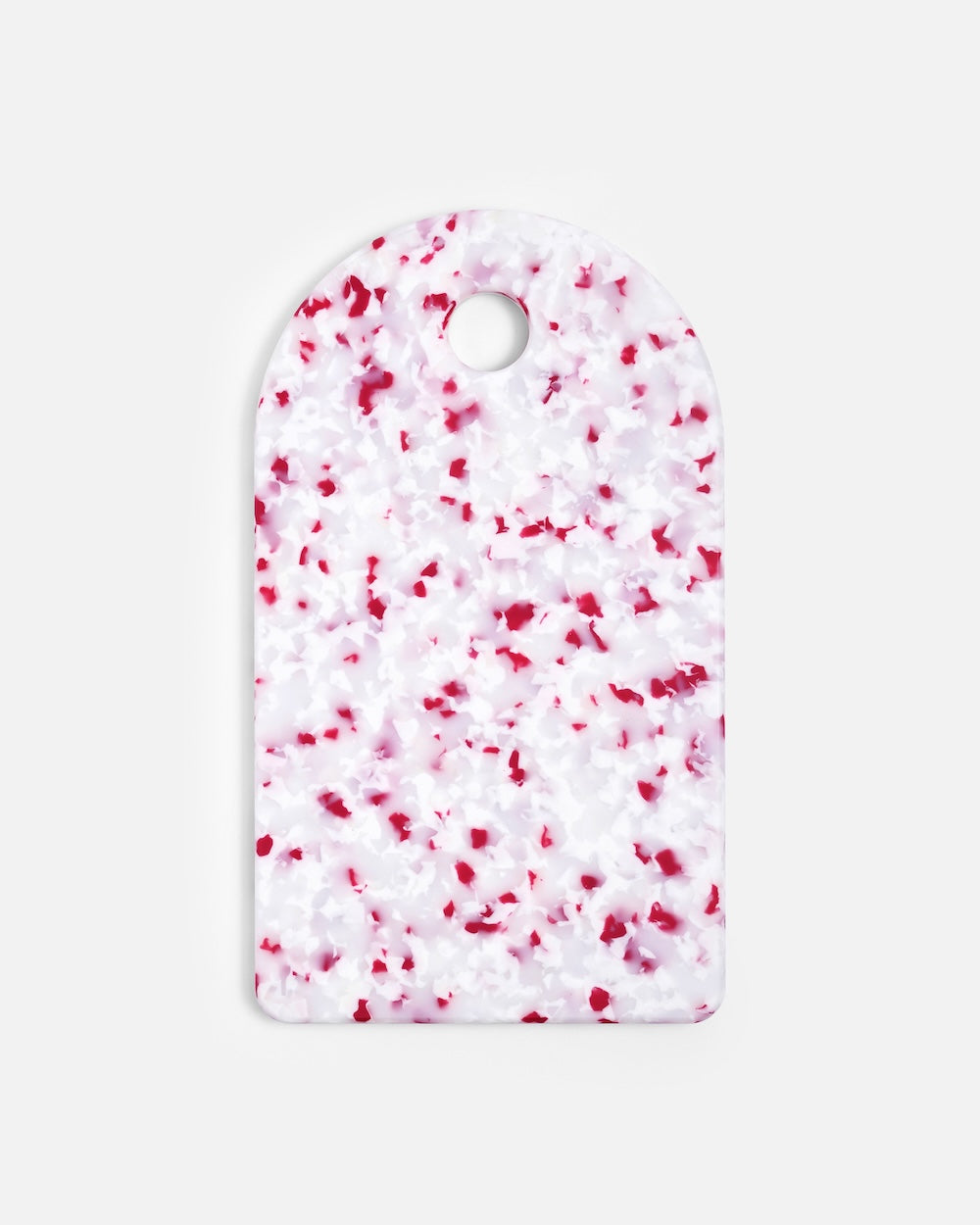 Rectangular cutting board with pink and white terrazzo pattern and rounded top