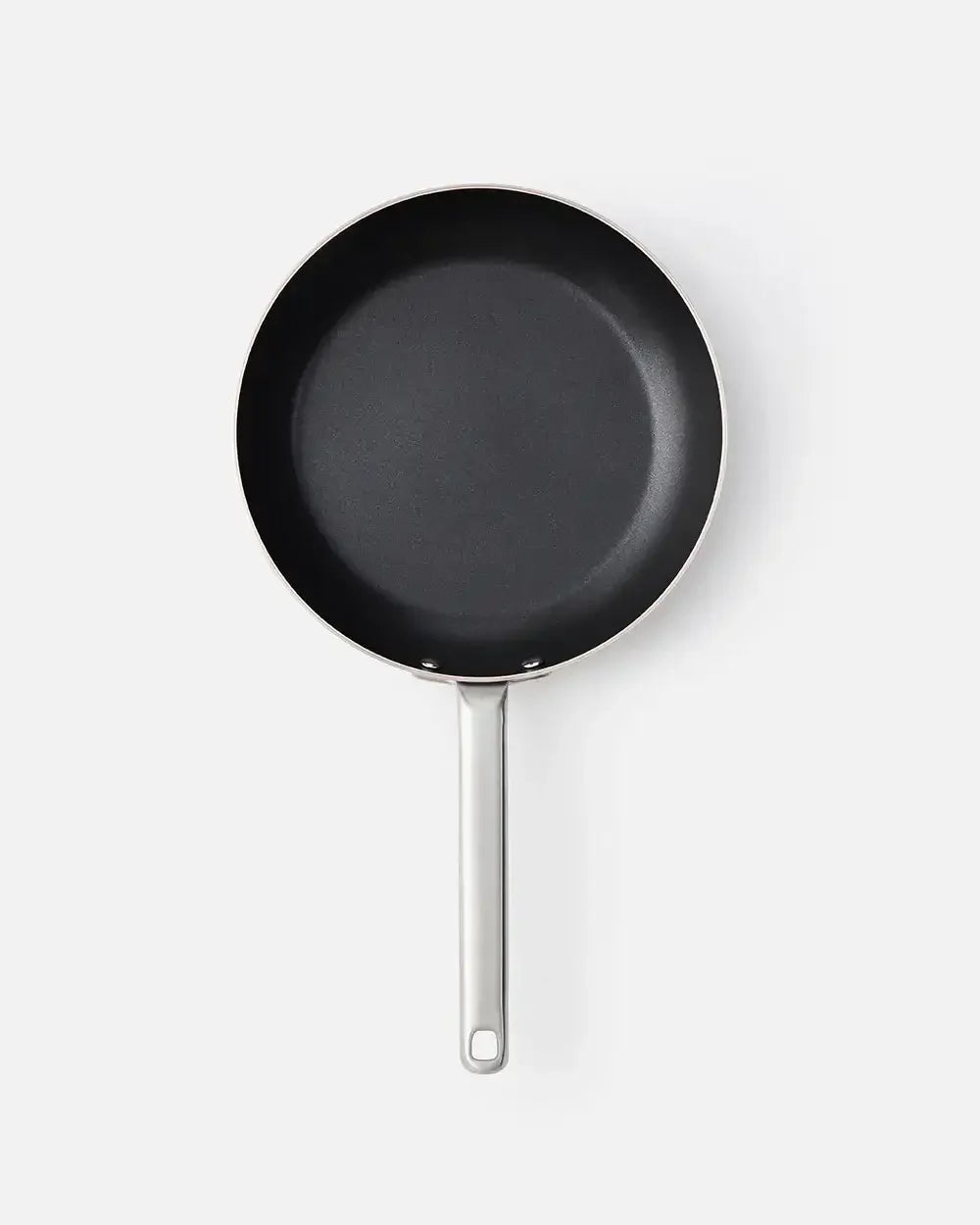 Non-stick frying pan with metal handle on white background, 25cm skillet for cooking