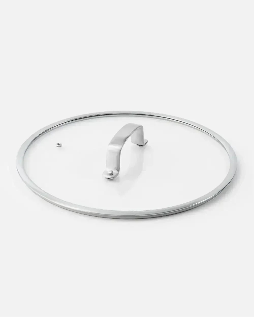 Tempered glass cookware lid with stainless steel rim and handle on white background