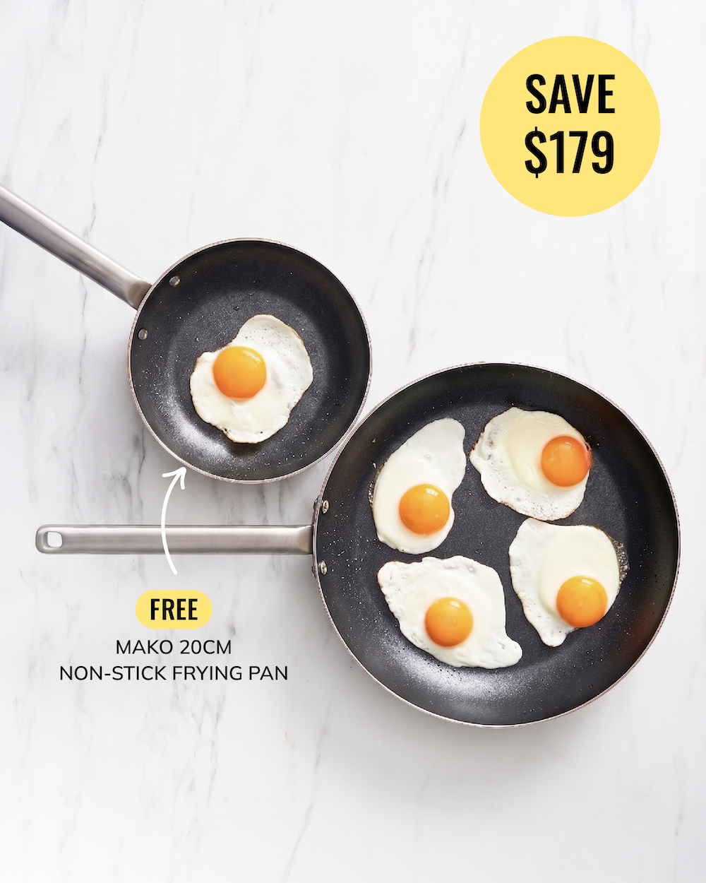 Two black non-stick frying pans with silver handles are shown on a white marble background, with eggs cooking in both pans. Text overlays advertise a free 20cm pan and a discount of $179.