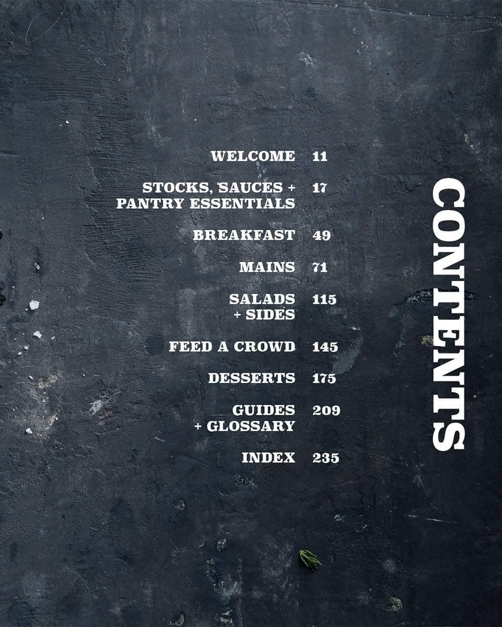 Cookbook table of contents on dark textured background with sections for breakfast, mains, salads, desserts, guides, and index.