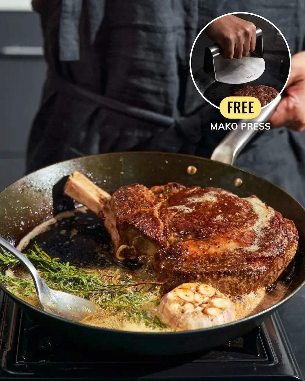 MAKO Black Steel Steak Pan - CookDineHost meat in pan basting with garlic butter herbs